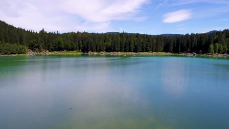 lake lago di fusine superiore italy alps. aerial fpv drone flights.