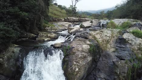 Flying-over-the-beautiful-countryside-nature-of-rivers,-waterfalls-and-trees-of-Brazil