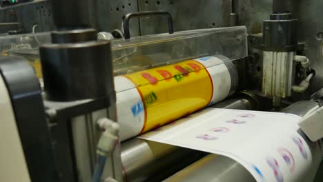 printing press working at high speed. machine printing labels for products industrialization for chain work