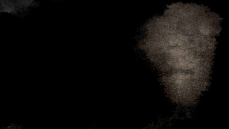Effetto astratto di diffusione dell'inchiostro su sfondo nero.
