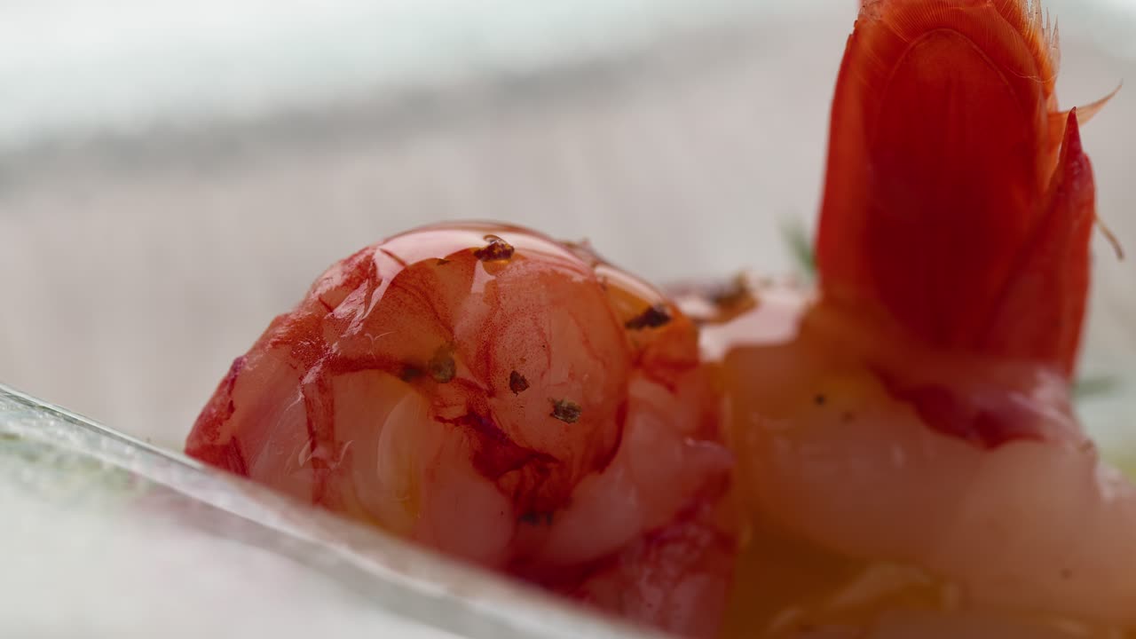 A tasteful macro shot of olive oil being poured over a shrimp, evoking summer vibes in Taormina, Sicily, Italy (Taormina, Sicilia, Italia)