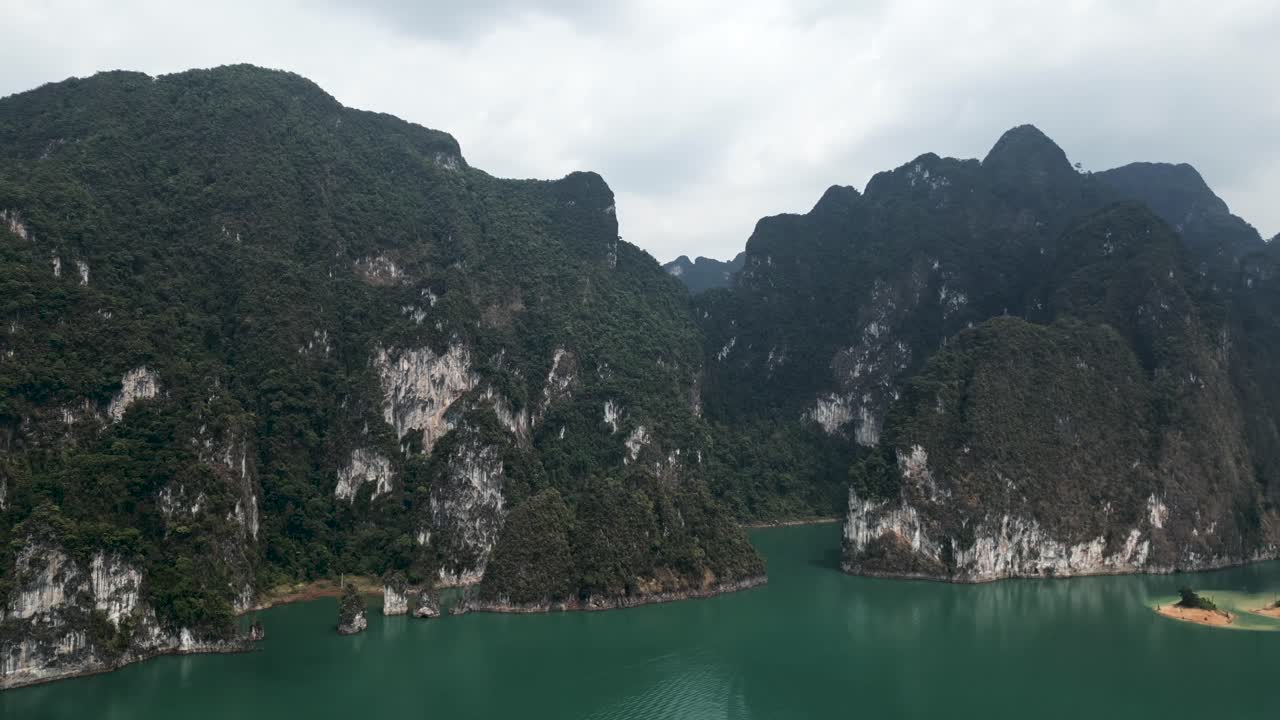 Scenic Tropical Landscape of Limestone Karst Mountains and Green Lake
