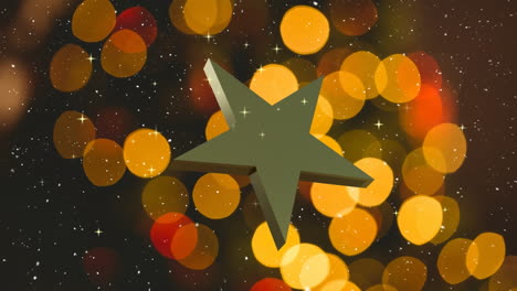 rotating gold christmas star over falling snow with orange and red bokeh lights on dark background