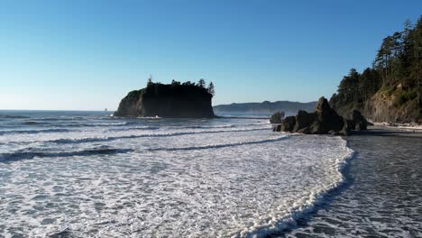 Flying-over-Ruby-beach-at-sunset,-Oregon,-United-States