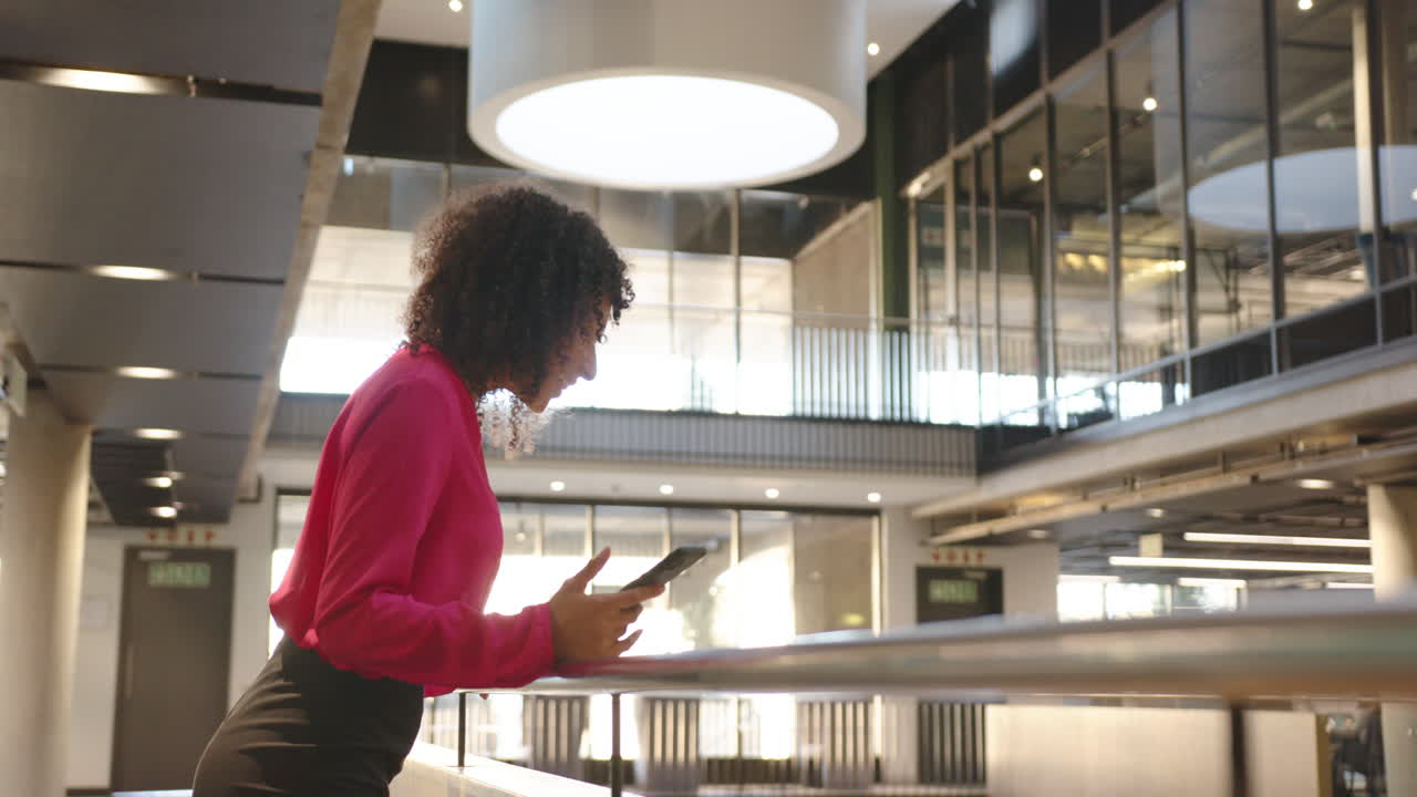 Using tablet, woman working in modern office building, focusing on task, copy space