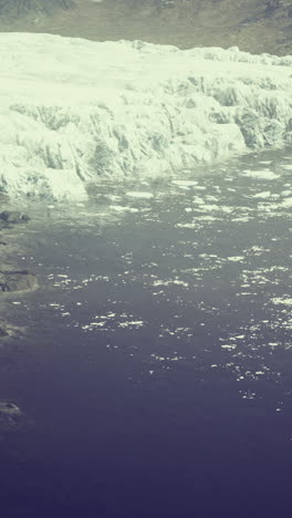 Majestic glacial landscape meeting the tranquil waters captured from above
