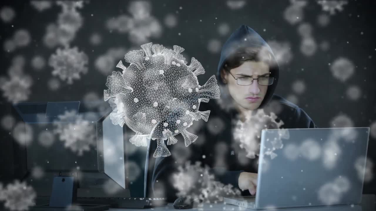 노트북을 사용하여 후디를 입은 남성에 대한 거대한 코로나19 세포의 애니메이션