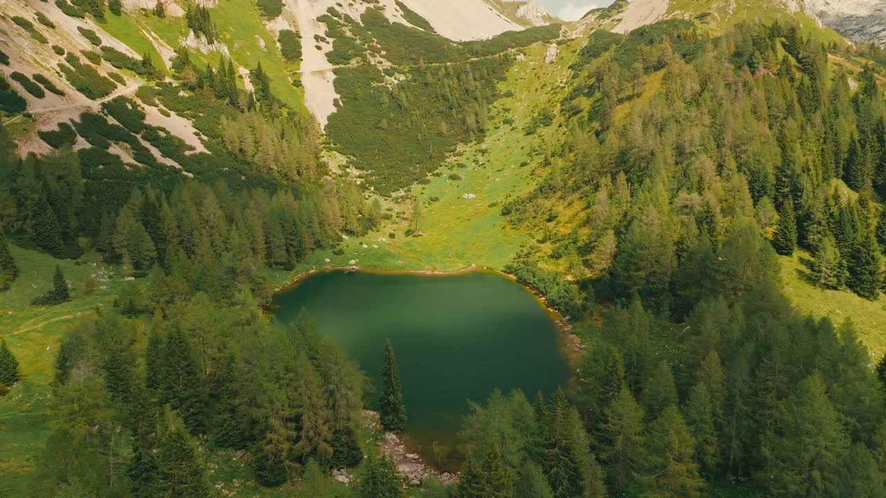 Serene hike in Italy's Dolomites, lush landscapes around Bordaglia Lake
