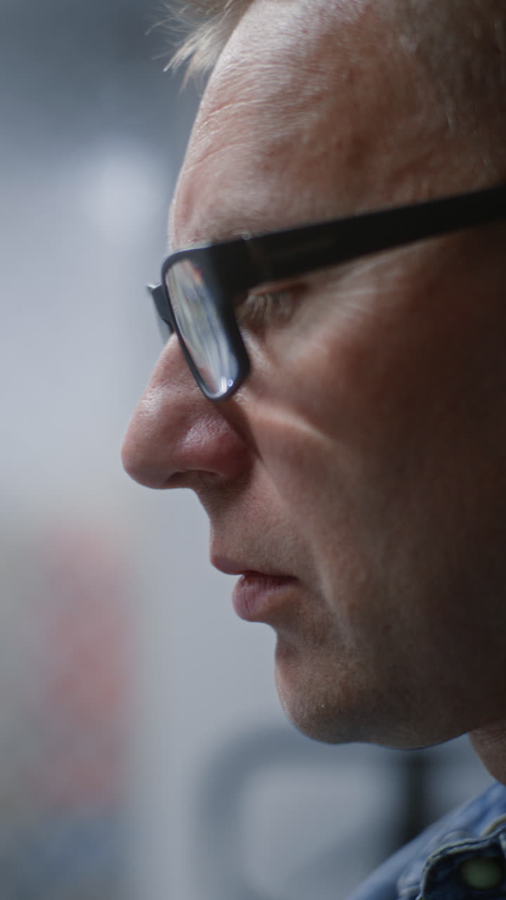 During Working Day in Workshop: Close Up of Focused Male Technician, Maintenance Worker Performing Detailed Manual Maintenance, Doing Handwork. Manual Labor, Craftsmanship, Repair Work. Vertical Shot.