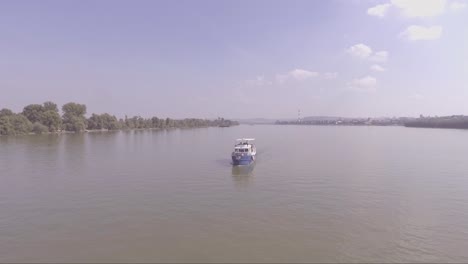 aerial of a boat traveling on the danube or sava river near belgrade serbia 1