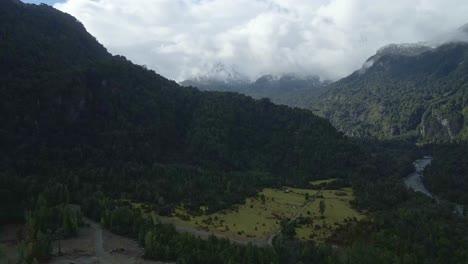 Dolly-out-aerial-view-of-snow-capped-mountains-in-Hornopiren-National-Park,-Hualaihue,-Chile