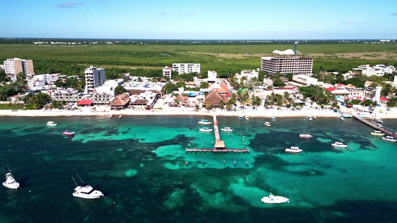 Aerial view of Puerto Morelos beach, showcasing vibrant seaside life