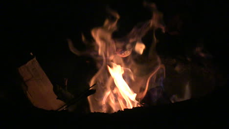 a close up shot of a marshmallow in a camp fire