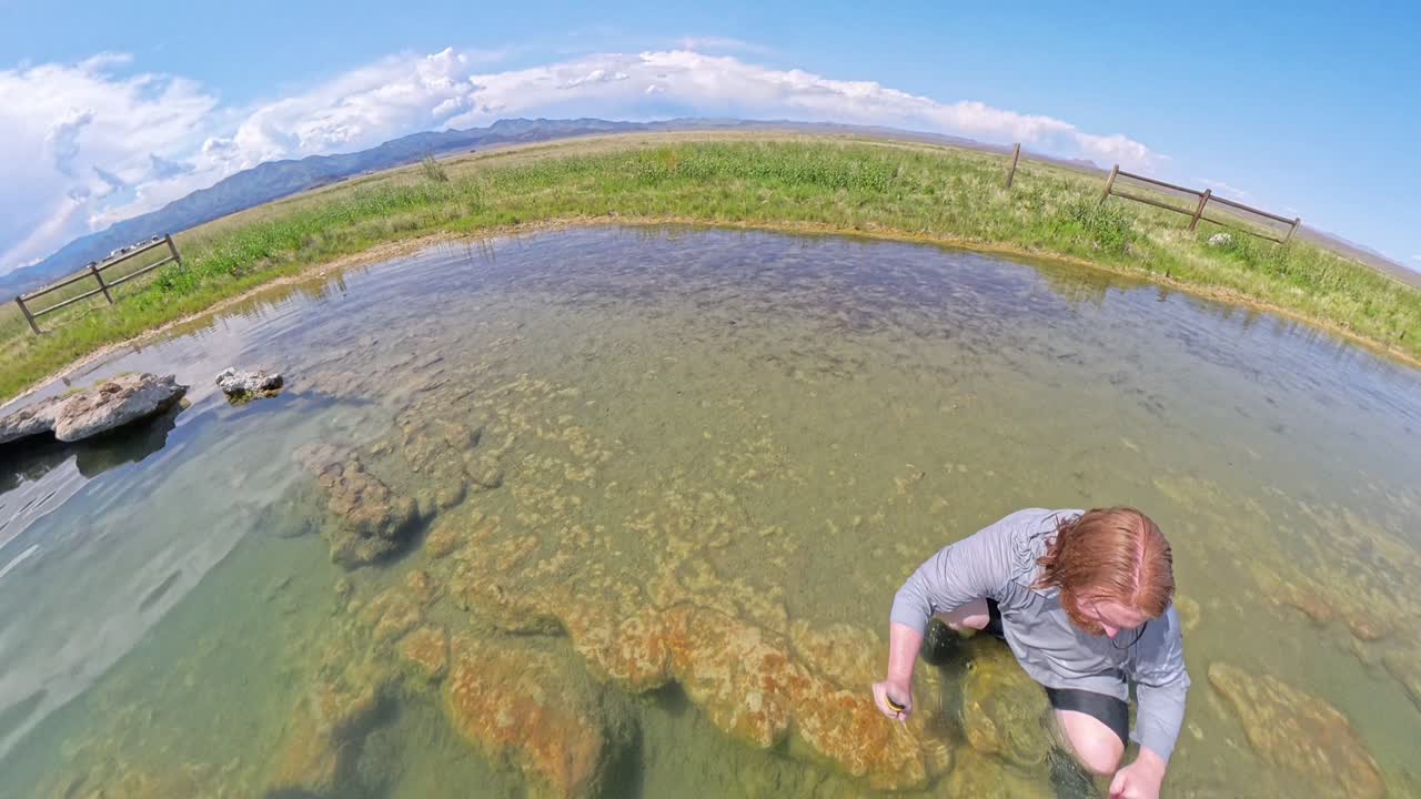 Hot Spring in Utah with a red haired male sitting in the water