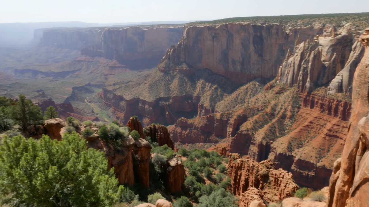 Panoramic Red Canyon Vista With Towering Sandstone Spires, Sunlit Layered Cliffs And Deep Shadowed Gorge,