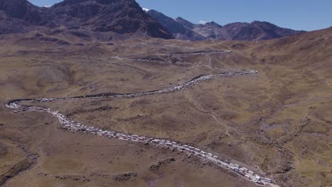 cinematic drone captures morning scene, citizens gather on huaytapallana mountain for tayta shanti festival