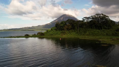 unique static red canoe on lake in tropical outdoors