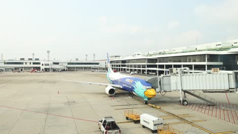 commercial jet boarding process at airport terminal