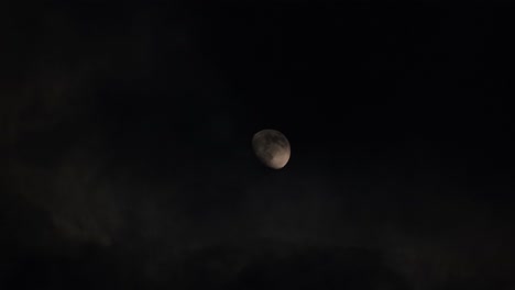 moon visible through clouds at night