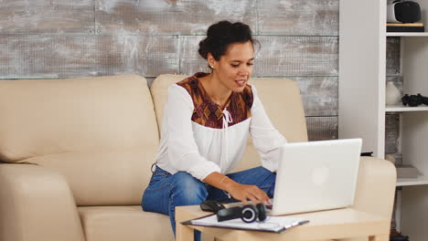 Cheerful-woman-waving-during-a-video-call