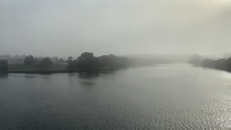 river or lake covered with thick fog in sydney, australia