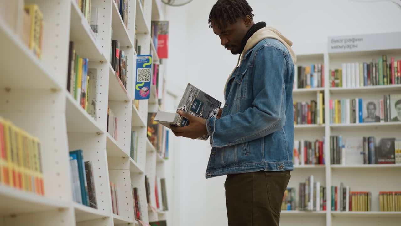 Student browsing bookshelf in modern library, carefully selecting books from shelves, exploring educational materials in quiet atmosphere, surrounded by rows of colorful book spines