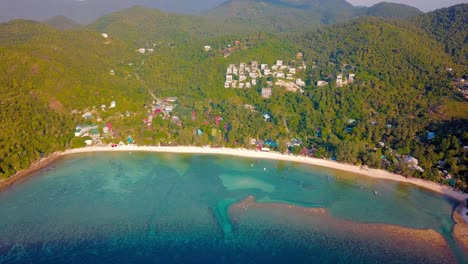 4k-Drone-Footage-of-the-Beach-at-Mae-Nam-on-Koh-Samui-in-Thailand,-Including-Beachfront-Resorts-with-Beautiful-Clouds-in-the-Sky-and-Crystal-Teal-Water