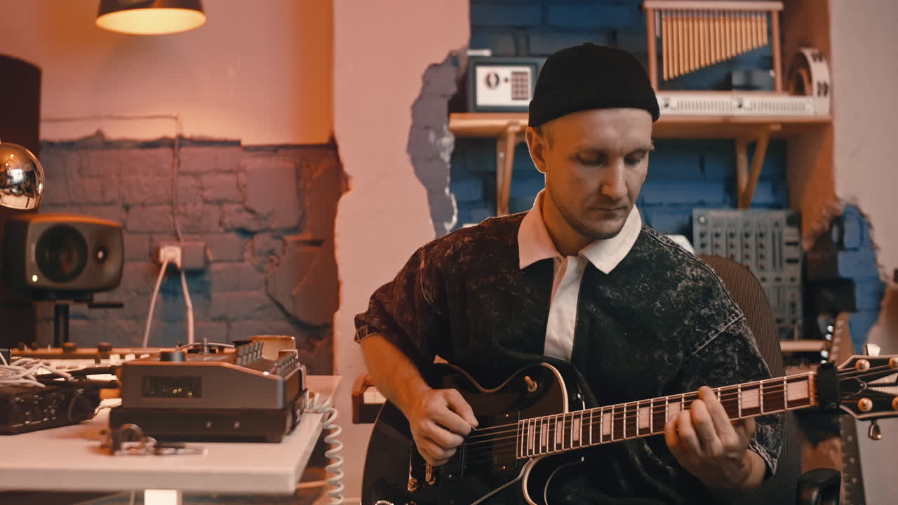 Musician Playing Electric Guitar in Recording Studio