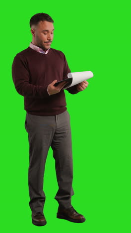 man looking at paper