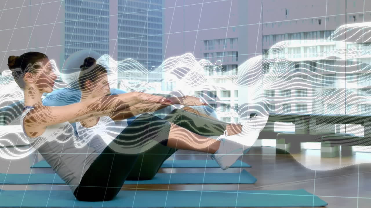 Three fitness participants holding boat pose on blue mats in studio, showing digital grid overlay