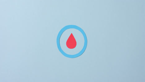 Close-up-of-blood-drop-in-blue-circle-on-blue-background,-copy-space,-slow-motion