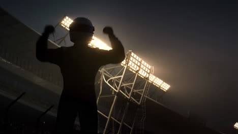 racer celebrating victory in stadium