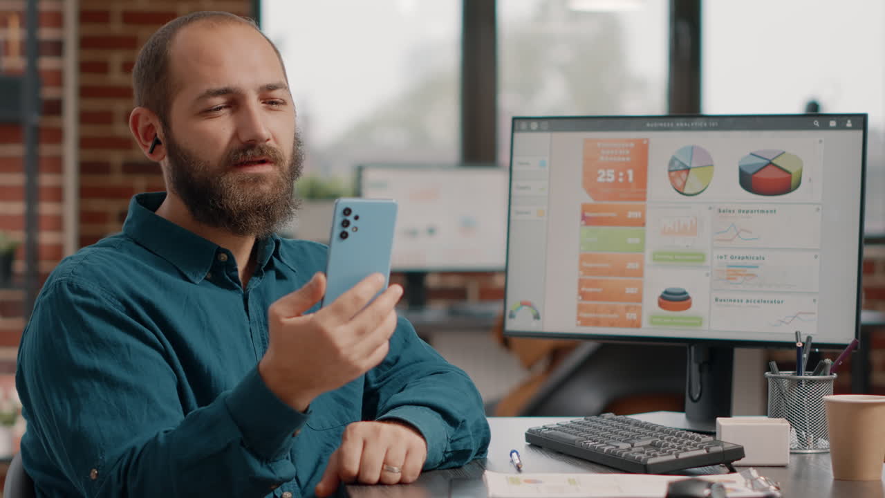 Man working in the office using smartphone