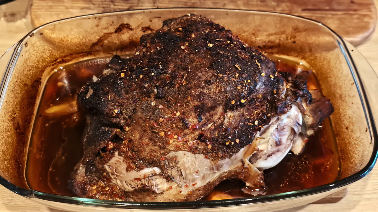 Roasted meat in a glass dish from Jelgava, Latvia showing rich flavors