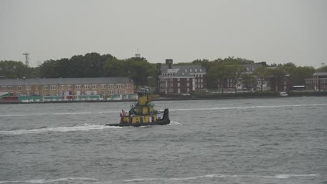 governors island new york city with boat on the hudson river