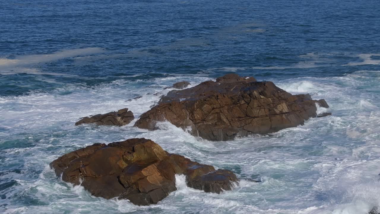 Sea Waves Crashing On The Rocks At Praia da Salsa In Arteixo, A Coruña, Galicia, Spain. Aerial Shot