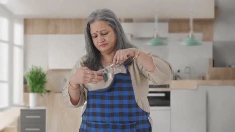 Indian-aged-housewife-making-food