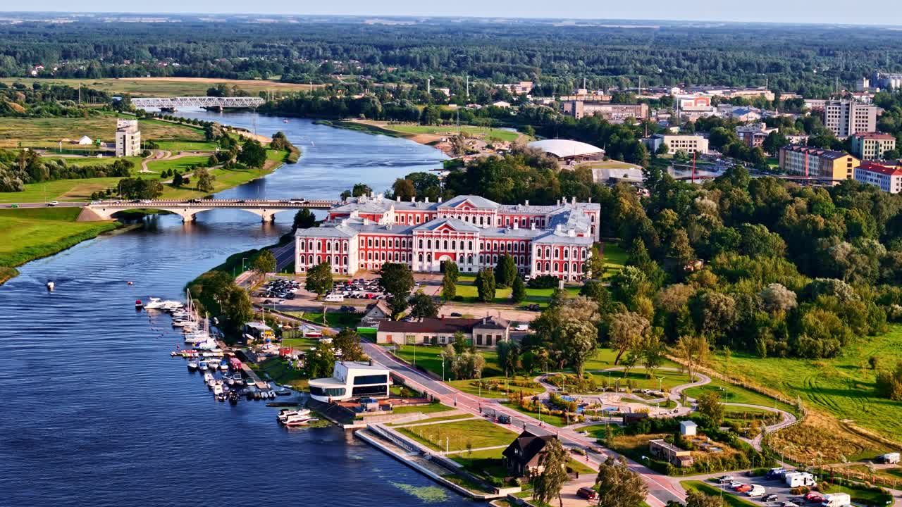Aerial view of Jelgava Castle with green landscape and Lielupe river on summer day