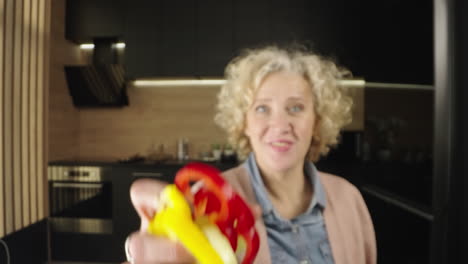 woman putting vegetables into a bowl