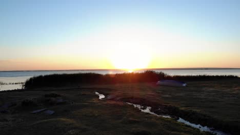 Beautiful-Sunrise-Over-The-Calm-Waters-Of-Lake