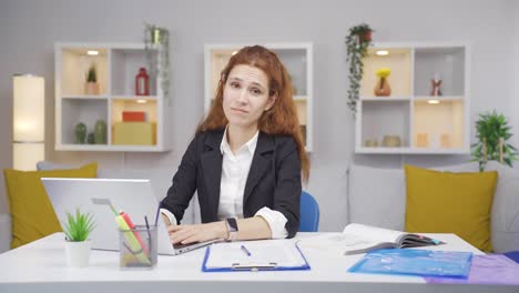 Home-office-worker-woman-says-shhh-to-camera.