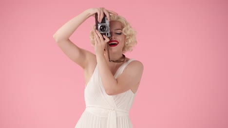 woman in 1950s fashion with camera