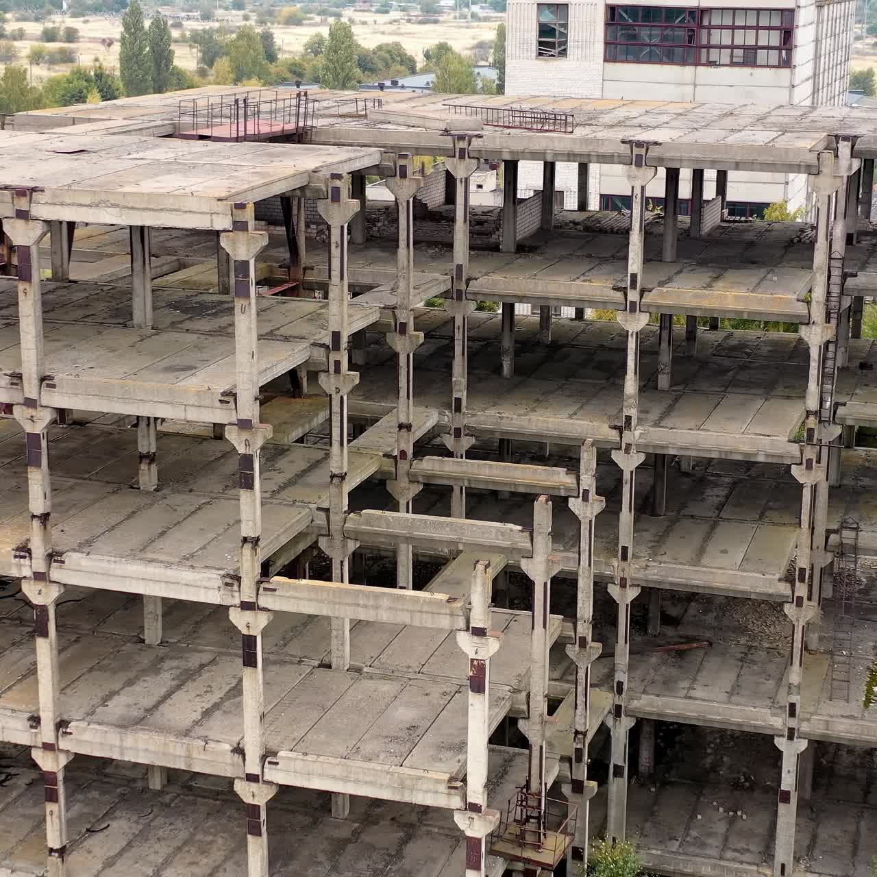 Industrial destroyed city buildings. Aerial view of destructive abandoned architecture