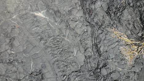 Top-down-drone-shot-providing-a-unique-perspective-of-the-new-lava-landscape,-5-years-after-the-eruption-of-Kilauea's-Fissure-8-eruption-in-2018