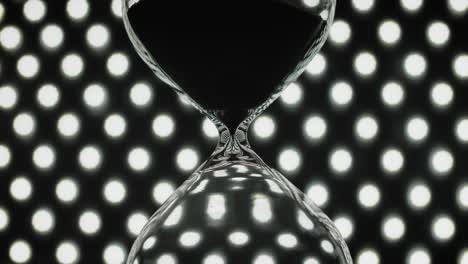 hourglass on background of bokeh lights