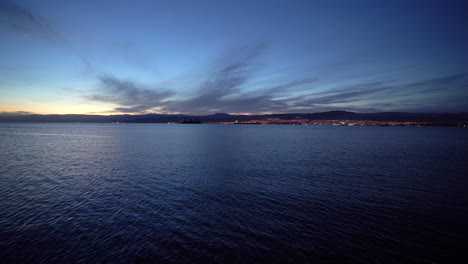 extreme long shot of eilat and its blinking lights late in the evening