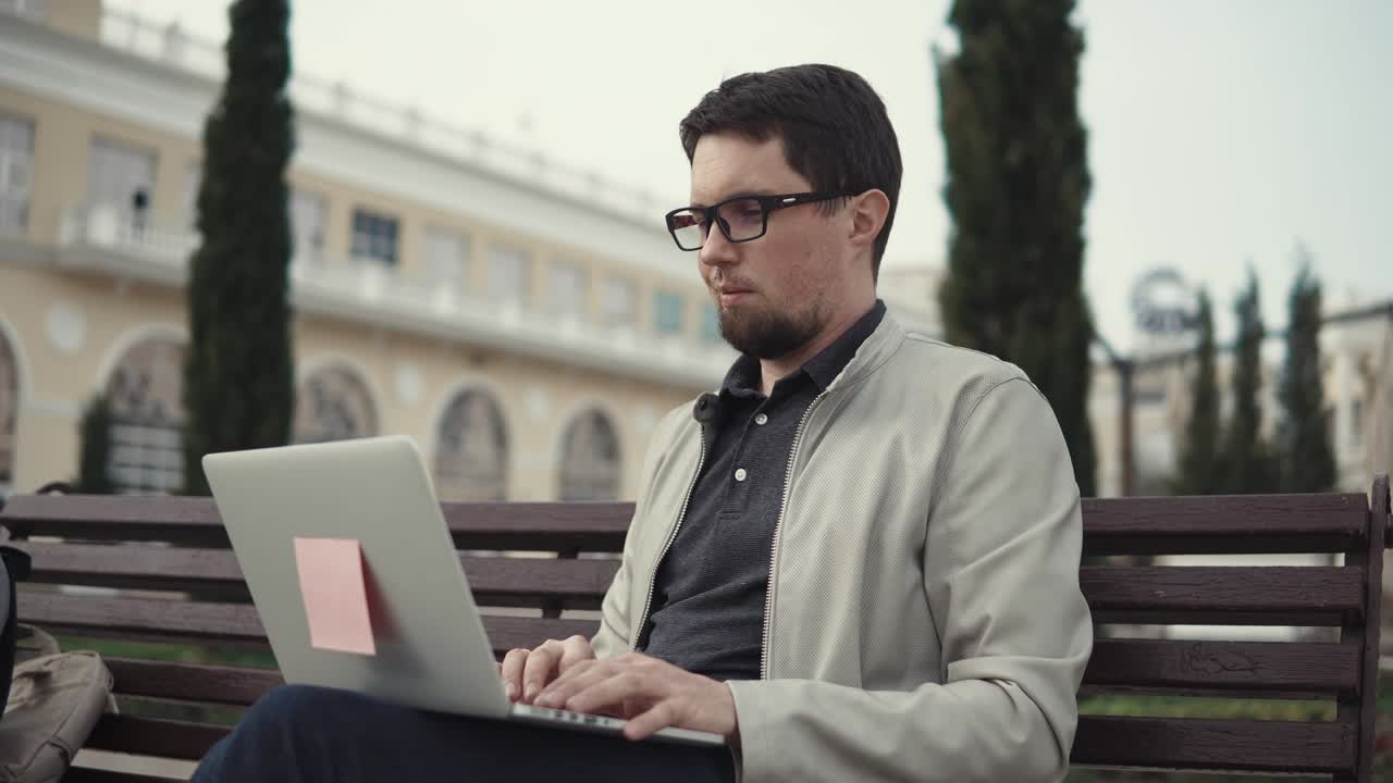 adult graduate student writes a thesis for university studies on a laptop