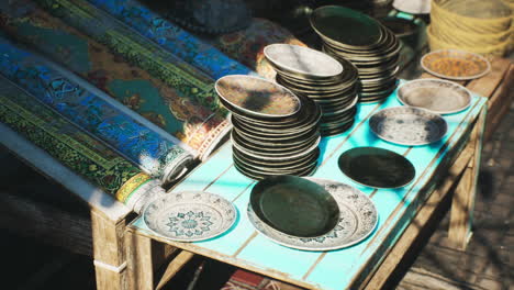 colorful market display of traditional plates in a small african town