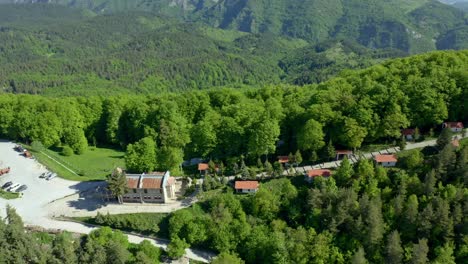 aerial trucking shot of krastova gora,the largest christian centers in bulgaria during sunny day