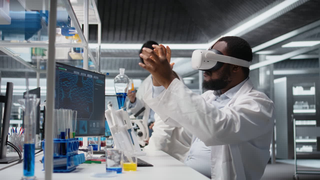 Vertical video Lab engineer at PC desk using VR goggles to look at molecular model, rotating it
